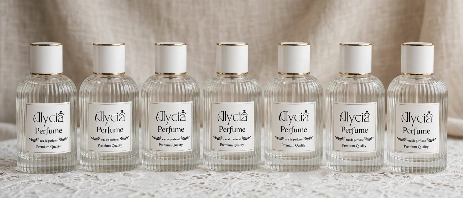Botol Alycia Perfume berjejer di atas kain ivory